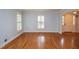 Spacious empty living room featuring hardwood floors and bright, natural light at 970 Winding Creek Trl, Atlanta, GA 30328