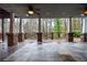 Stone patio with stone pillars, wood railings, and beautiful outdoor space to enjoy the view at 970 Winding Creek Trl, Atlanta, GA 30328