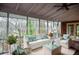 Screened in porch staged with furniture for outdoor living at 970 Winding Creek Trl, Atlanta, GA 30328