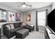 Bedroom with a gray sofa, movie posters and a window with natural light at 1925 Barnett West Ct, Buford, GA 30518