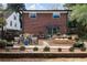 Outdoor patio featuring brick accents, a dining area, and comfortable seating, perfect for outdoor entertainment and relaxation at 412 E Pharr Rd, Decatur, GA 30030