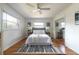 Bright and airy bedroom with ceiling fan, hardwood floors, neutral decor, and ample closet space at 412 E Pharr Rd, Decatur, GA 30030