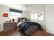 Bright bedroom featuring hardwood floors, ceiling fan, window, art and neutral walls at 412 E Pharr Rd, Decatur, GA 30030