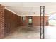 Spacious brick carport featuring a decorative metal post and enough room for parking and storage at 412 E Pharr Rd, Decatur, GA 30030