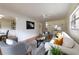 Dining area featuring a modern glass table, decorative chairs, stylish shelving, and natural light at 412 E Pharr Rd, Decatur, GA 30030