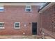 Classic brick exterior showcasing traditional architecture with multiple windows and a backdoor at 412 E Pharr Rd, Decatur, GA 30030
