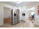 Spacious kitchen with stainless steel refrigerator, built-in microwave, white cabinets, and tile floors at 412 E Pharr Rd, Decatur, GA 30030