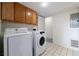 Convenient laundry room with modern Samsung washer and dryer set and ceramic tile flooring at 412 E Pharr Rd, Decatur, GA 30030