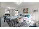 Bright and airy living room with white walls, a comfortable sofa, and a view to the outdoors at 412 E Pharr Rd, Decatur, GA 30030