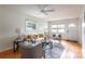 Inviting living room featuring hardwood floors, a ceiling fan, neutral decor, and natural light at 412 E Pharr Rd, Decatur, GA 30030
