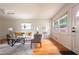 Bright living room with hardwood floors, a ceiling fan, large windows, and stylish furniture creating a cozy atmosphere at 412 E Pharr Rd, Decatur, GA 30030