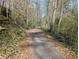 Paved walking trail winding through lush greenery offers a tranquil outdoor escape at 412 E Pharr Rd, Decatur, GA 30030