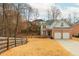 Charming brick home with a well-maintained yard and two-car garage at 6220 Crofton Dr, Alpharetta, GA 30005