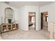 Open hallway with large mirror and views into a bedroom and bathroom at 6220 Crofton Dr, Alpharetta, GA 30005