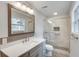 Updated bathroom with a large mirror, gray vanity, and tiled walk-in shower at 120 Arrowood Ln, Alpharetta, GA 30009
