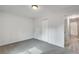 A neutral bedroom featuring access to a hallway with wood-look floors at 120 Arrowood Ln, Alpharetta, GA 30009