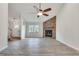 Spacious living room featuring a stone fireplace and a large window at 120 Arrowood Ln, Alpharetta, GA 30009