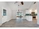 Bright living area with vaulted ceiling, wood-look floors, and eat-in kitchen with emerald tile backsplash at 120 Arrowood Ln, Alpharetta, GA 30009
