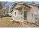 Cozy back porch with white railings and access to the backyard at 207 Garrison Se Rd, Marietta, GA 30008
