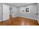 Neutral bedroom with hardwood floors, a window, and a full-size closet at 207 Garrison Se Rd, Marietta, GA 30008