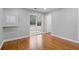 Neutral bedroom with hardwood floors, sliding glass door to patio, and a full-size closet at 207 Garrison Se Rd, Marietta, GA 30008