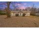Charming home featuring a landscaped front yard and inviting entrance at 207 Garrison Se Rd, Marietta, GA 30008