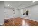 Open living room features hardwood floors, fresh paint and plenty of natural light at 207 Garrison Se Rd, Marietta, GA 30008