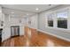 Spacious living room with hardwood floors, stainless steel dishwasher, and natural light at 207 Garrison Se Rd, Marietta, GA 30008