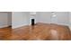 Living room boasts gleaming hardwood floors and a decorative fireplace at 207 Garrison Se Rd, Marietta, GA 30008