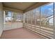 Enclosed porch with wood deck and a view of the backyard and adjacent properties at 207 Garrison Se Rd, Marietta, GA 30008