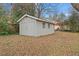 Backyard shed providing extra storage with a neutral color and double doors at 207 Garrison Se Rd, Marietta, GA 30008