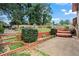 Spacious backyard with a tiered garden, a deck and mature trees at 3710 Oregon Trl, Decatur, GA 30032