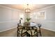 Cozy dining room with elegant chandelier and large windows at 3710 Oregon Trl, Decatur, GA 30032