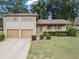 Charming two-story brick home with well-manicured landscaping and a two car garage at 3710 Oregon Trl, Decatur, GA 30032