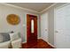 Inviting foyer with hardwood floors, decorative lighting, and classic interior door at 3710 Oregon Trl, Decatur, GA 30032