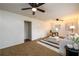 Spacious living room with carpeted floors, white walls, modern furniture, and a ceiling fan at 3710 Oregon Trl, Decatur, GA 30032