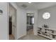 Upstairs hallway featuring an octagonal window and bookcase at 5555 Sugar Crossing Dr, Sugar Hill, GA 30518