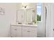 Modern bathroom features double vanity with framed mirrors, white cabinets, and stylish fixtures at 100 5Th St, Fayetteville, GA 30214