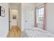 Bright bedroom offers a peaceful retreat with a light-filled window and charming decor at 100 5Th St, Fayetteville, GA 30214