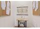 A well-lit room featuring a vintage sewing machine table and inspirational wall art at 100 5Th St, Fayetteville, GA 30214