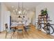 Dining area featuring hardwood floors and stylish bike rack at 100 5Th St, Fayetteville, GA 30214