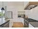 Kitchen with stainless steel appliances, white cabinets, and butcher block countertops at 100 5Th St, Fayetteville, GA 30214