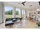 Open-concept living room with natural light, modern furniture, and an adjacent dining area at 100 5Th St, Fayetteville, GA 30214