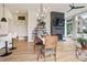 An open floor plan connects the living area to the dining area, with a large brick fireplace and built-in shelving at 100 5Th St, Fayetteville, GA 30214