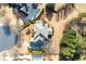 Aerial shot of home showcasing its expansive lot, mature trees, and neighborhood at 195 High Bluff Ct, Duluth, GA 30097