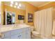 Bright bathroom features a white vanity, shower with a curtain, and a mirrored wall at 195 High Bluff Ct, Duluth, GA 30097