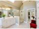 Bathroom featuring white cabinets, a large framed mirror, glass shower, and a view to another bathroom at 195 High Bluff Ct, Duluth, GA 30097