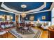 Elegant dining room with hardwood floors, chandelier, and ample seating for formal dinners at 195 High Bluff Ct, Duluth, GA 30097