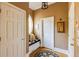 Hallway with a window seat, wood floors, neutral walls, white trim and doors, and stylish light fixtures at 195 High Bluff Ct, Duluth, GA 30097