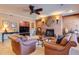 Cozy living room with brick fireplace, exposed brick walls, and comfortable leather furniture at 195 High Bluff Ct, Duluth, GA 30097